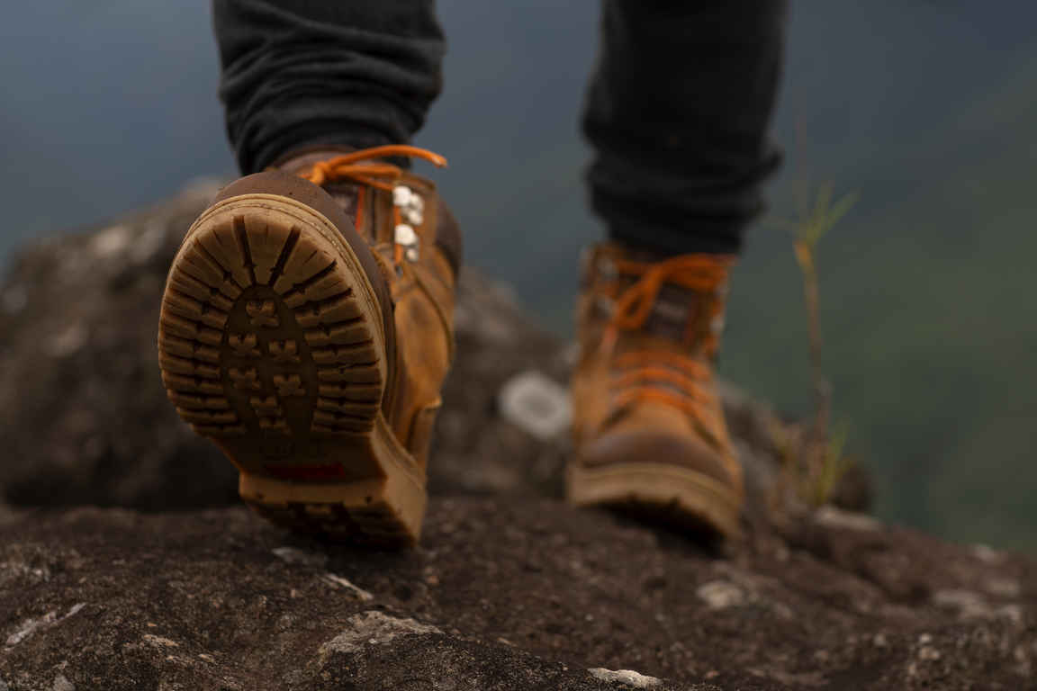 Low angle adventurous man bivouacking