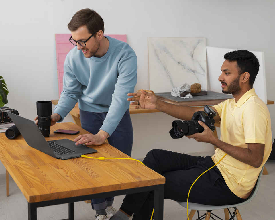 Full shot specialized photographers working in studio