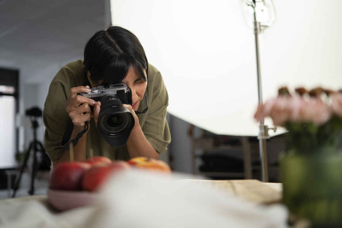 Front view woman working as a photographer